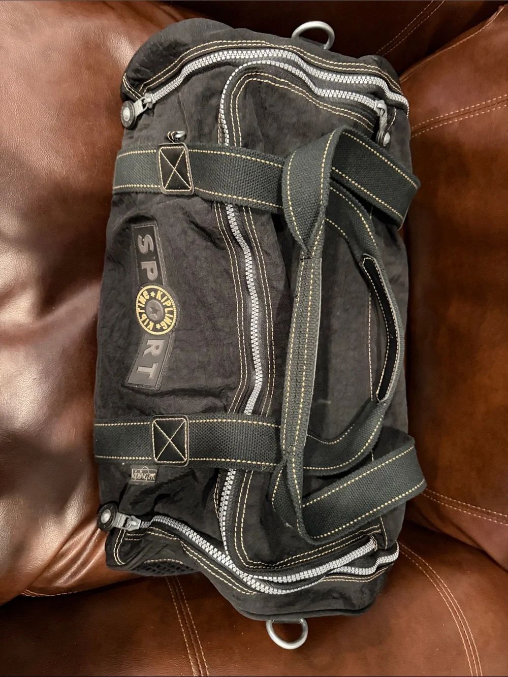 Kipling Black Duffel Bag with Yellow Logo Accent